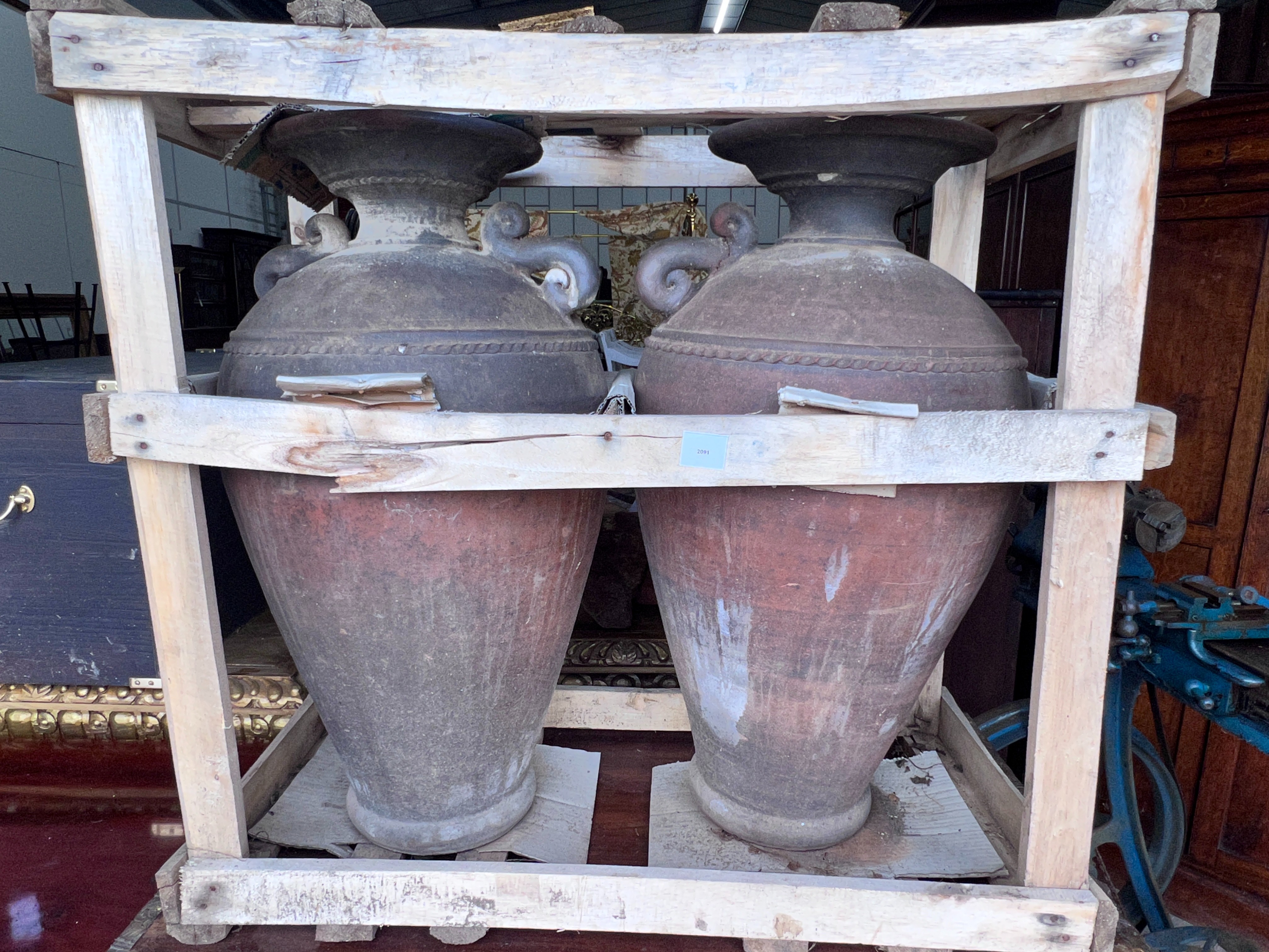 A pair of glazed pottery urns, height 84cm